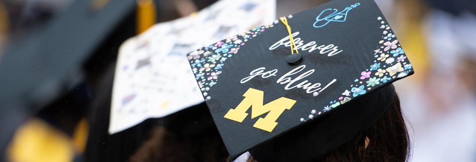 Decorated graduation cap with forever go blue written on it